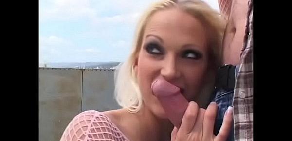  Awesome blonde bombshell in pink fishnet outfit Nicki Hunter get banged by three well hung studs on the roof and in the studio